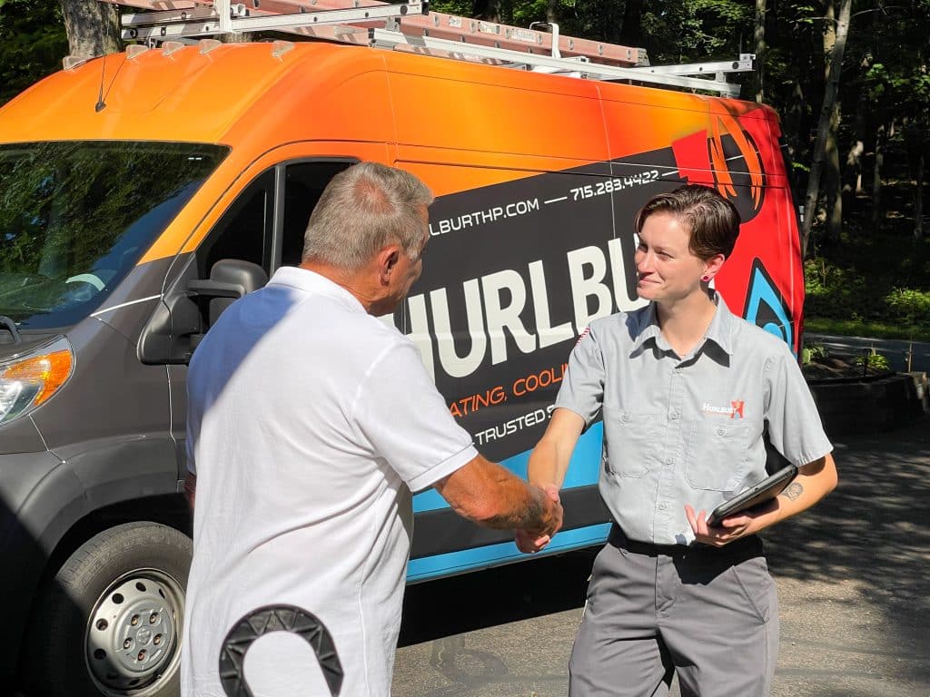 Electrician shaking hands with customer